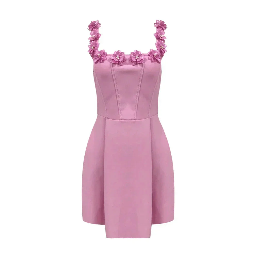 Pink - Sleeveless structured pink mini dress featuring a square neckline adorned with 3D floral appliqués, a tailored bodice with vertical seams, and a pleated A-line skirt with side pockets.