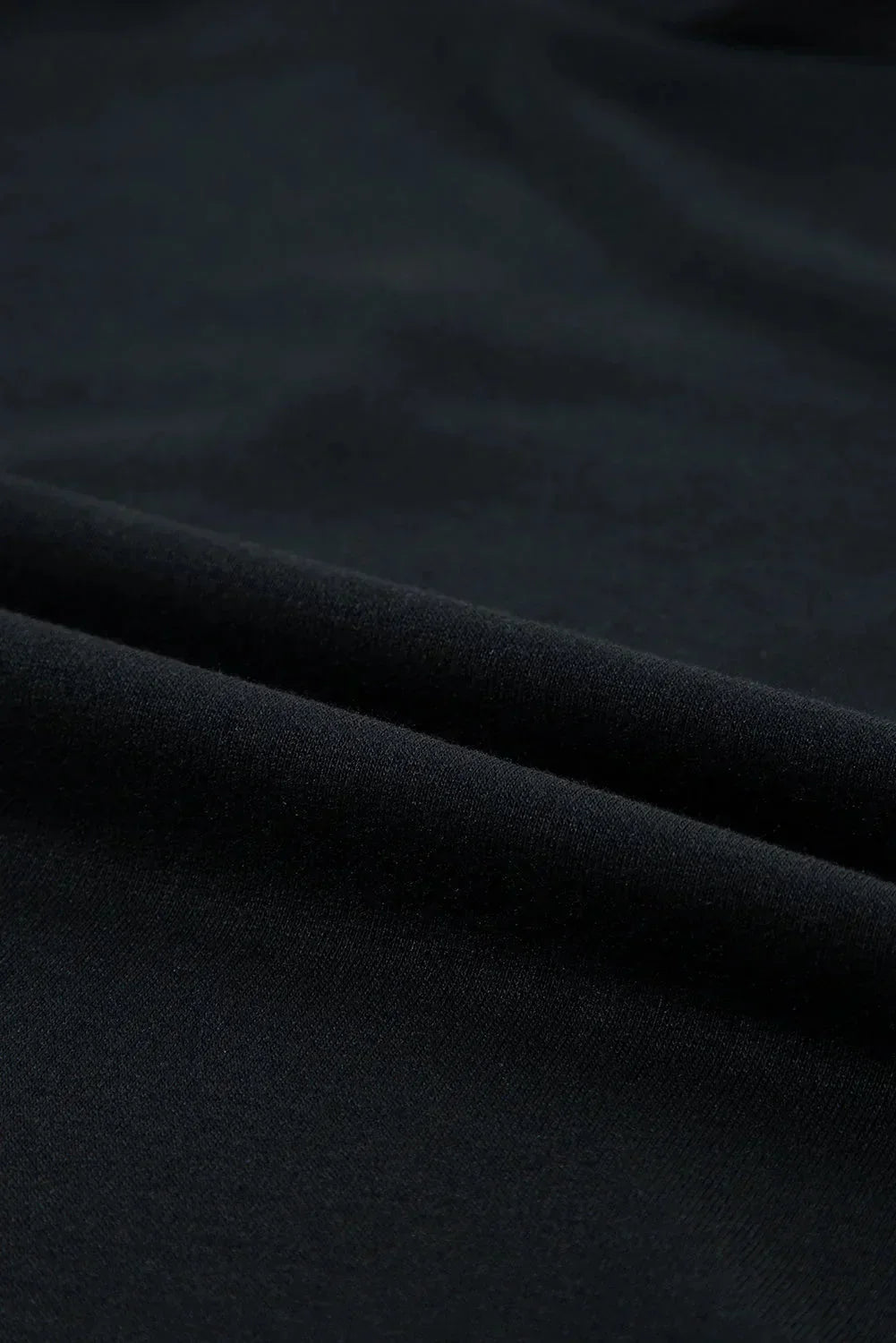 Black - Black textured mini dress featuring flutter sleeves, a high neckline, and a drop-waist ruffled hem.