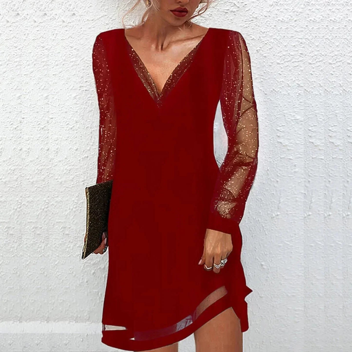 Red - Black mini dress featuring a solid V-neck bodice, long sheer tulle sleeves with metallic glitter flecks, and a sheer panel at the hem.