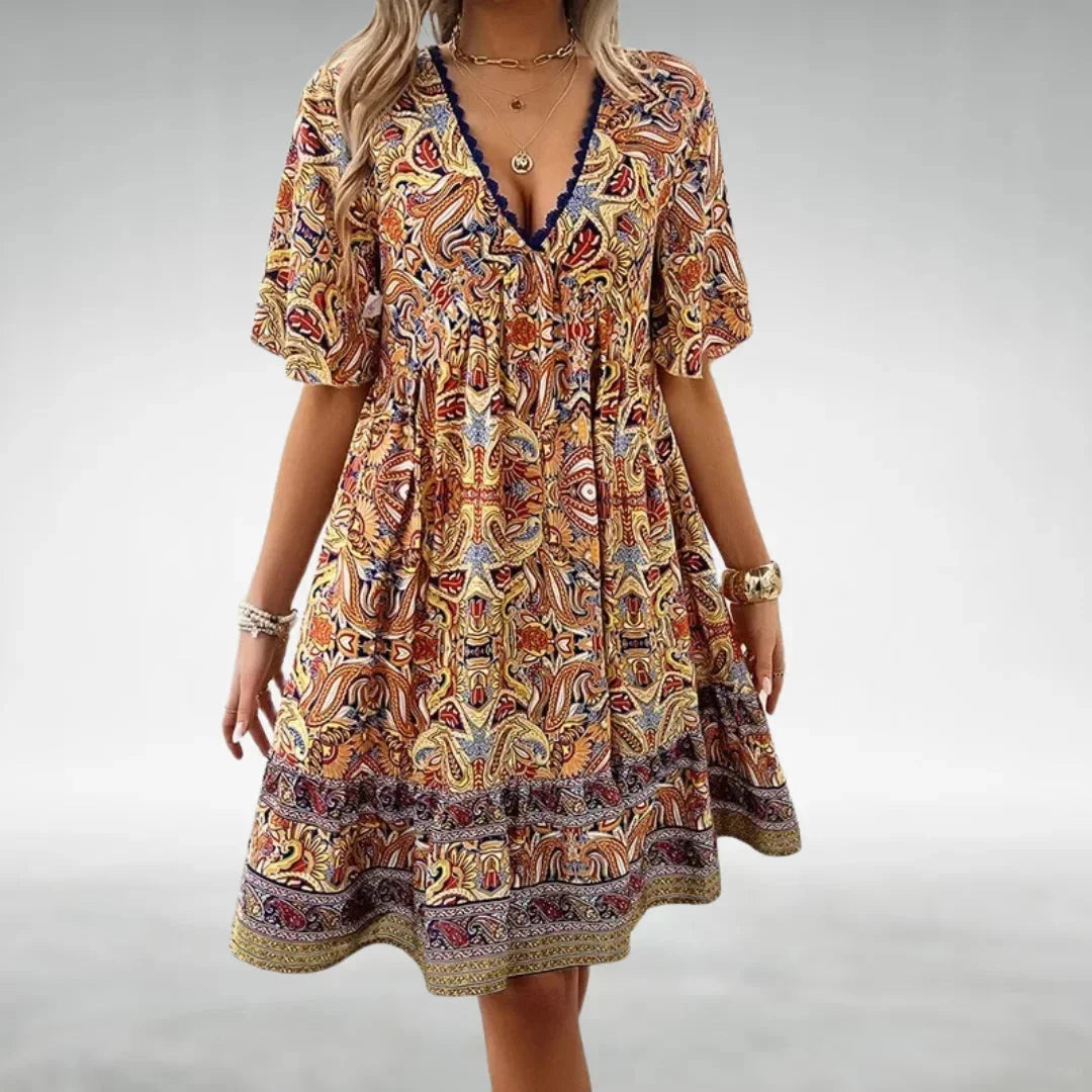 Yellow - Women's green and yellow intricate paisley print mini dress featuring a lace-trimmed V-neckline, flutter sleeves, and a tiered ruffled hem.