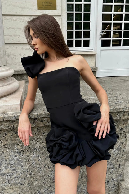 Green - Black strapless mini dress featuring an asymmetrical 3D rosette sleeve detail, tailored bodice, and a voluminous gathered bubble hem.