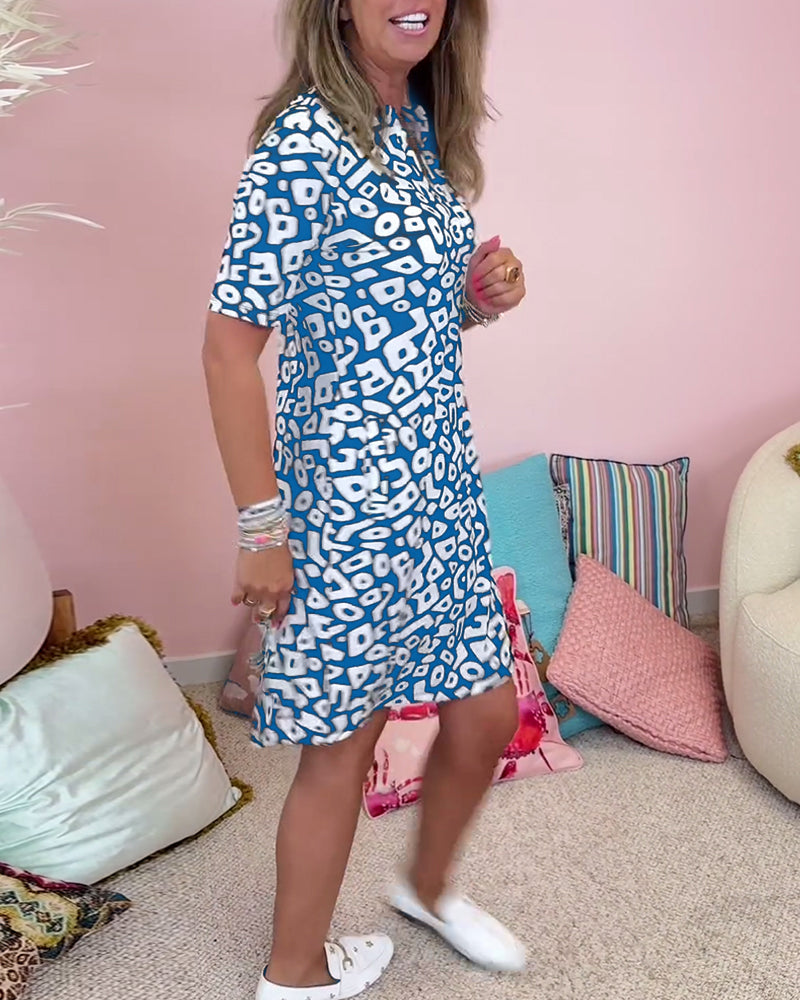 Blue - A woman wearing a black and white abstract geometric print shift dress with short sleeves, a split neckline, and side pockets.