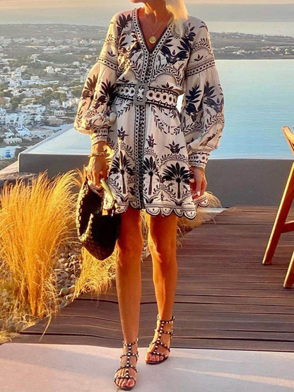 Black - Women's botanical print mini dress featuring voluminous balloon sleeves, a matching structured belt, deep V-neckline, and a scalloped hem.