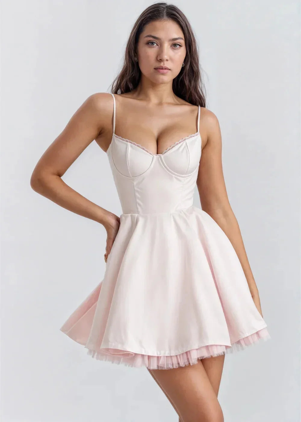 Pink - Light pink fit-and-flare mini dress featuring a structured bustier bodice with lace trim, spaghetti straps, and a voluminous skirt with a visible tulle hem underlay.