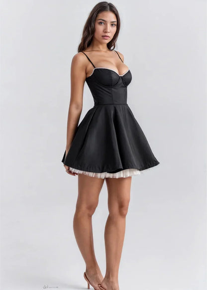 Black - Light pink fit-and-flare mini dress featuring a structured bustier bodice with lace trim, spaghetti straps, and a voluminous skirt with a visible tulle hem underlay.