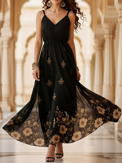 Black - Woman walking in a long, flowy, sleeveless maxi dress featuring a botanical floral pattern and spaghetti straps.