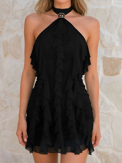 Black - Woman wearing a sheer chiffon mini dress featuring a halter neckline with hardware and cascading vertical ruffles.