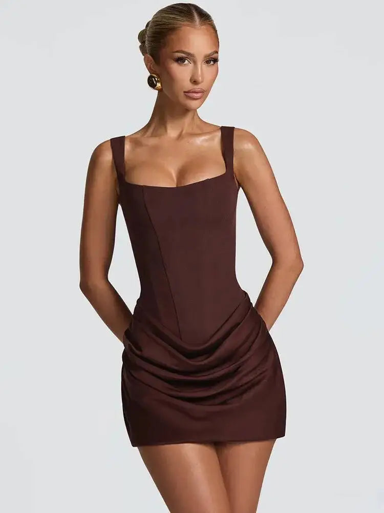 White - Dark brown crepe mini dress featuring a structured corset bodice with vertical seaming and a draped, ruched skirt.