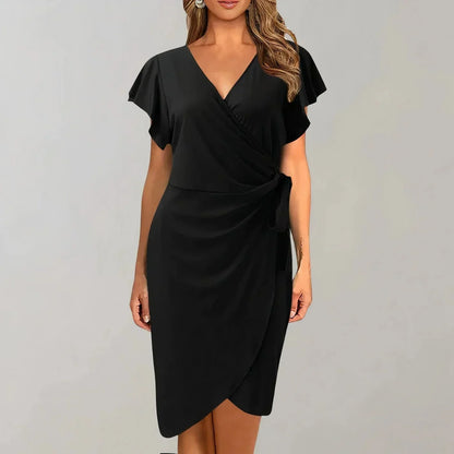 Black - Solid red crepe midi dress featuring a surplice V-neckline, short flutter sleeves, a ruched side tie waist, and an asymmetrical tulip hem.