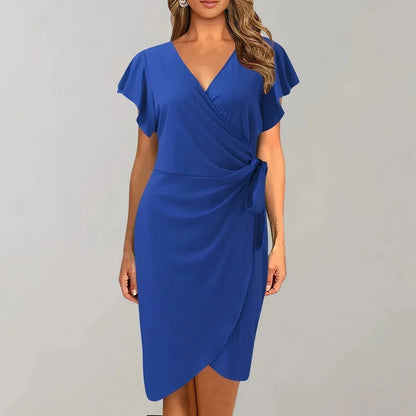 Blue - Solid red crepe midi dress featuring a surplice V-neckline, short flutter sleeves, a ruched side tie waist, and an asymmetrical tulip hem.