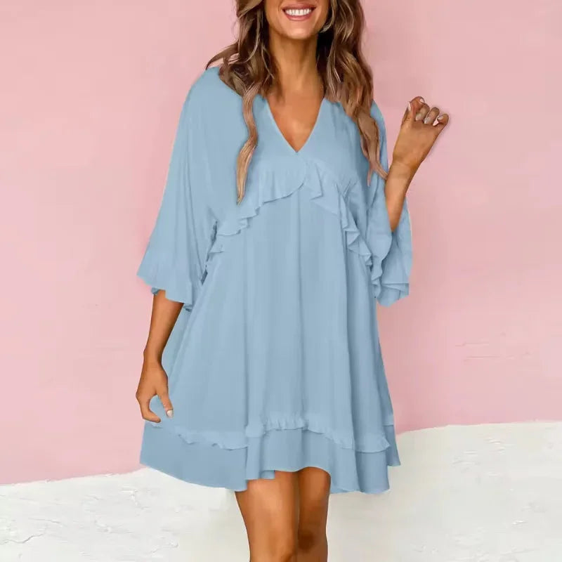 Blue - Black crepe swing mini dress featuring a V-neckline, half flutter sleeves, and ruffle trim detailing across the bodice and hem.