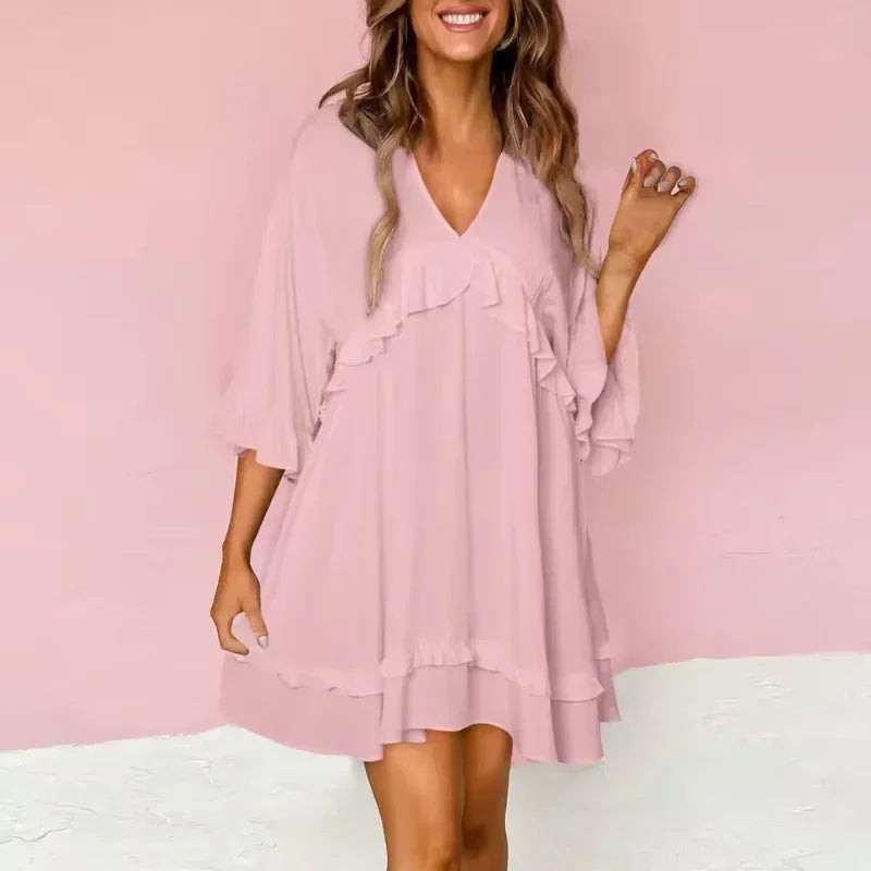 Light pink - Black crepe swing mini dress featuring a V-neckline, half flutter sleeves, and ruffle trim detailing across the bodice and hem.