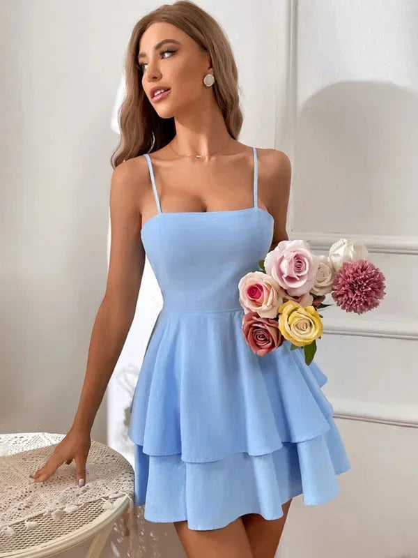 Blue - White crepe mini dress featuring a square neckline, thin spaghetti straps, a fitted bodice, and a two-tiered fit-and-flare skirt.