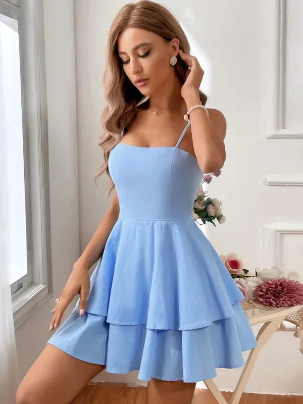 Blue - White crepe mini dress featuring a square neckline, thin spaghetti straps, a fitted bodice, and a two-tiered fit-and-flare skirt.
