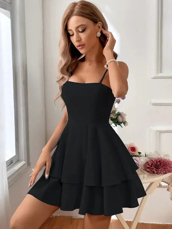 Black - White crepe mini dress featuring a square neckline, thin spaghetti straps, a fitted bodice, and a two-tiered fit-and-flare skirt.
