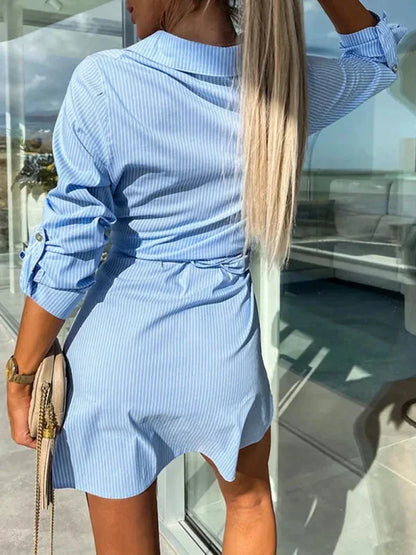 Blue - Bright green crisp button-front mini shirt dress with a point collar, rolled sleeves, and a defined tie-waist.