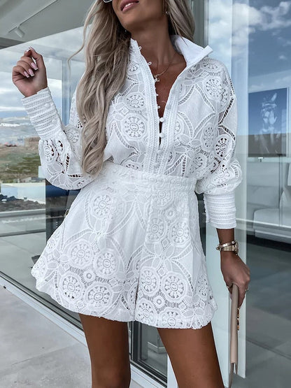White - White large-scale medallion crochet romper with long balloon sleeves, pointed collar, fabric-covered button placket, and high-waisted relaxed shorts.