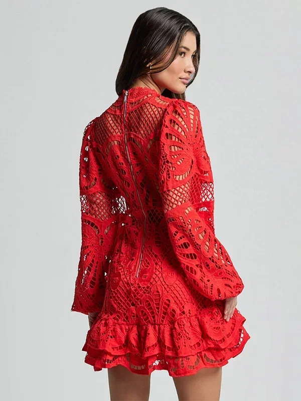 Red - Red crochet lace mini dress with high neckline, long bell sleeves, waist cutouts, and a tiered ruffle skirt.