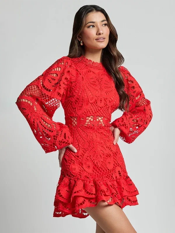 Red - Red crochet lace mini dress with high neckline, long bell sleeves, waist cutouts, and a tiered ruffle skirt.