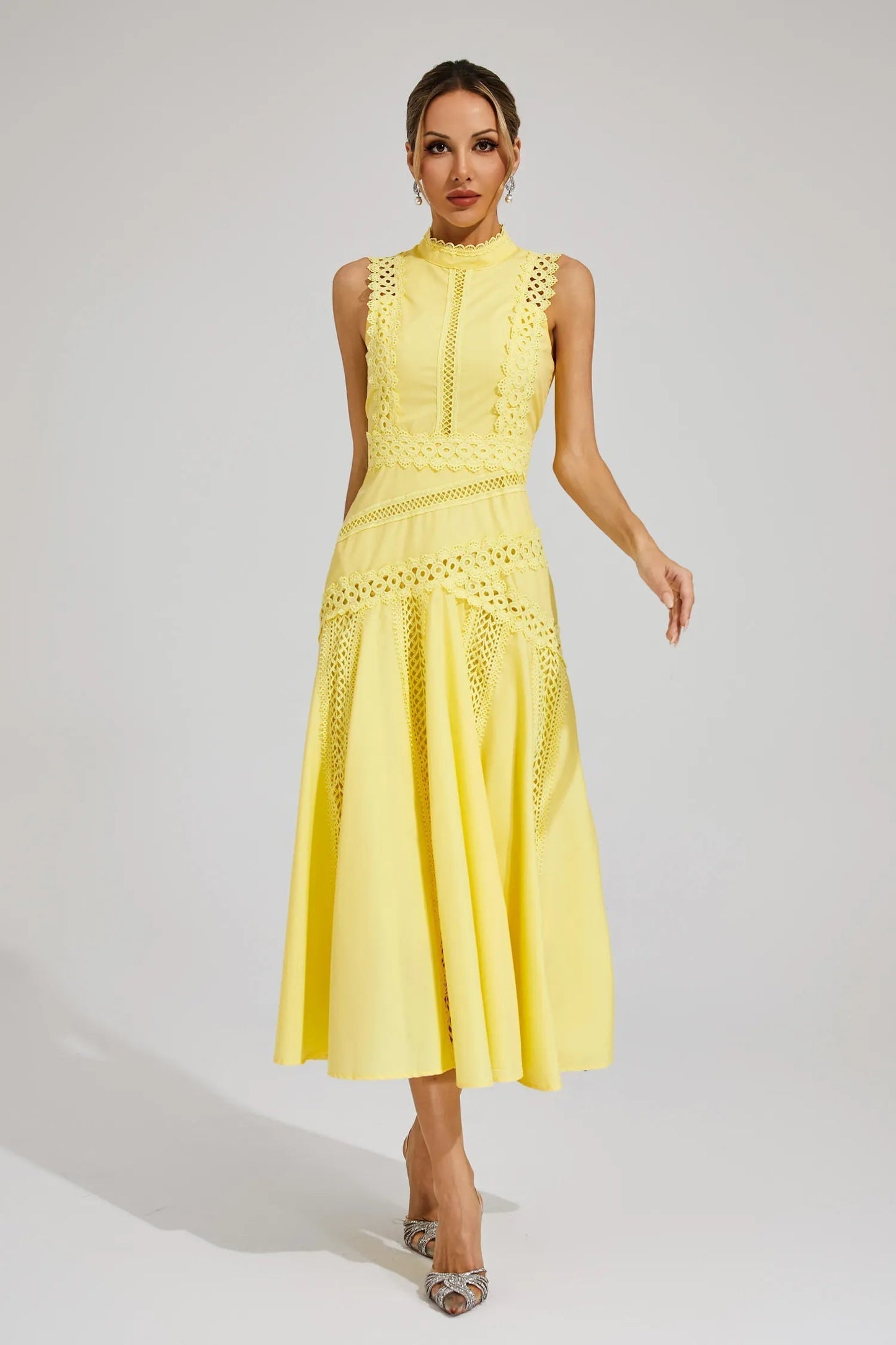 Yellow - Yellow sleeveless midi dress featuring a high neckline, intricate crochet lace paneling, and a flowing A-line skirt with vertical lace inserts.