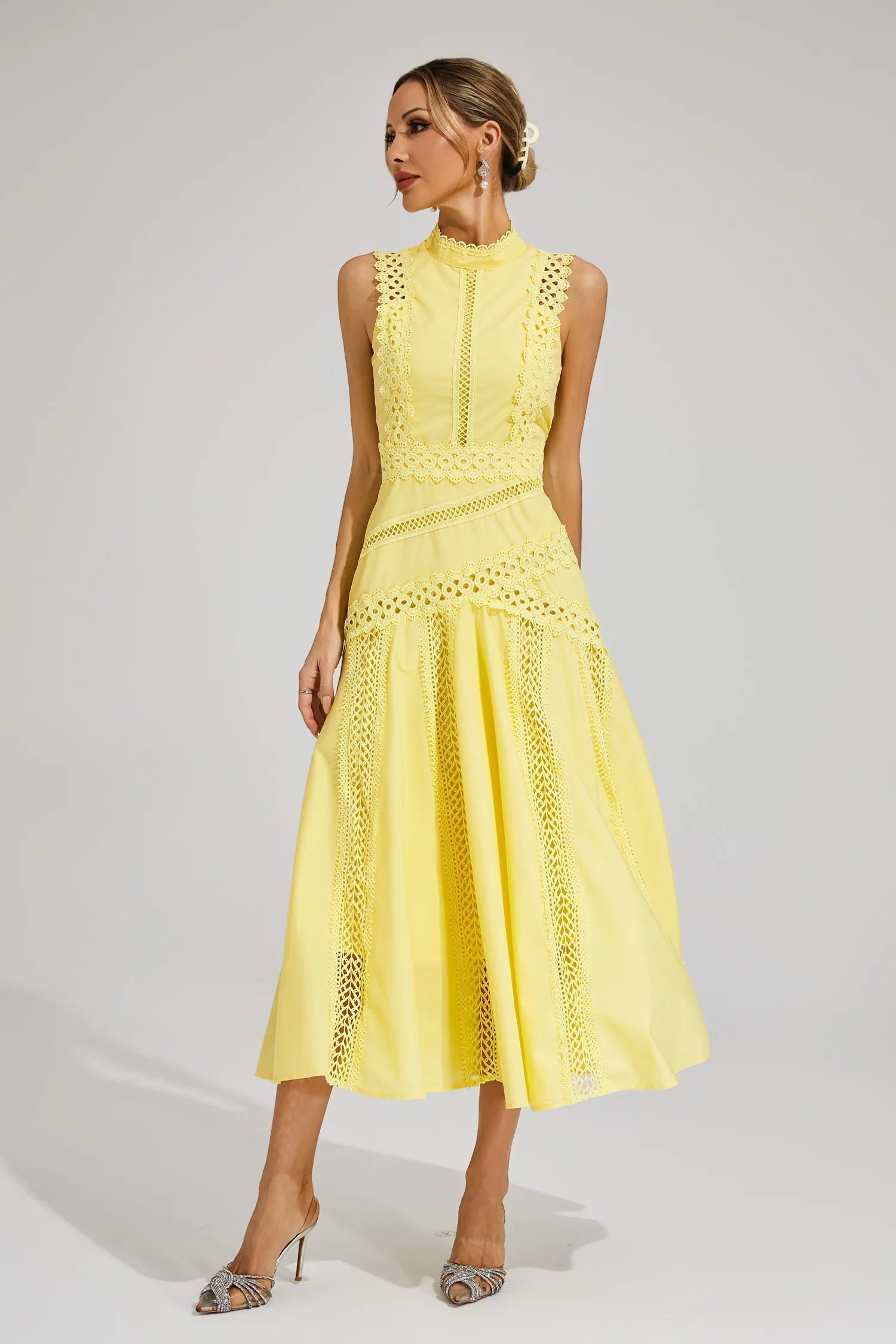 Blue - Yellow sleeveless midi dress featuring a high neckline, intricate crochet lace paneling, and a flowing A-line skirt with vertical lace inserts.