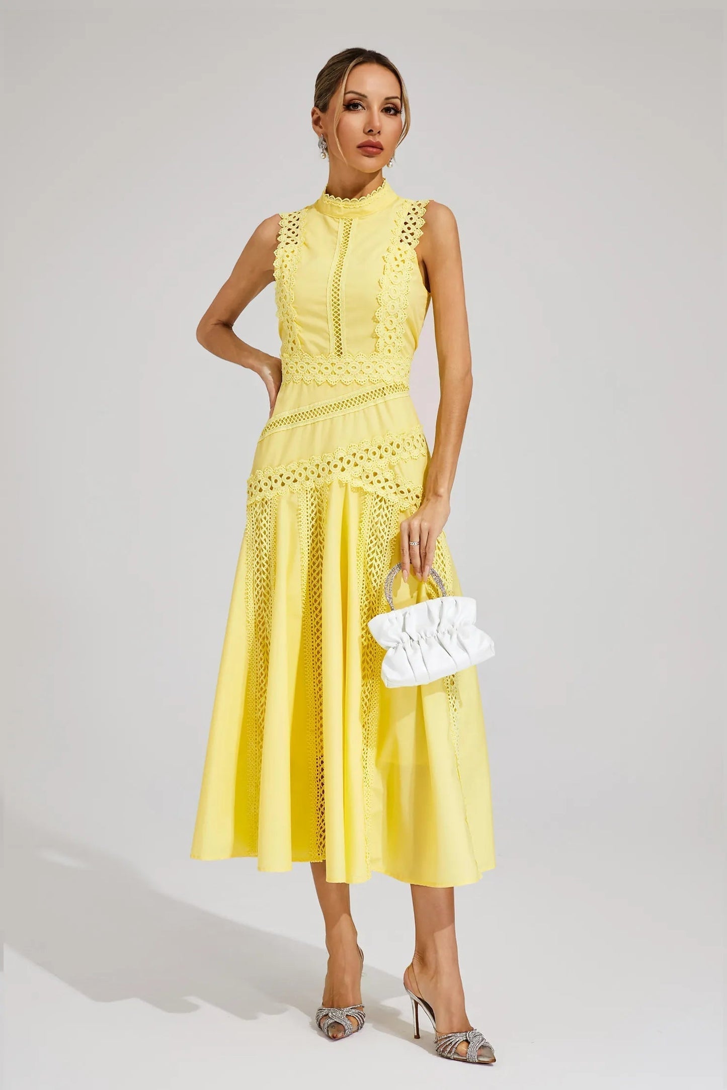 Blue - Yellow sleeveless midi dress featuring a high neckline, intricate crochet lace paneling, and a flowing A-line skirt with vertical lace inserts.