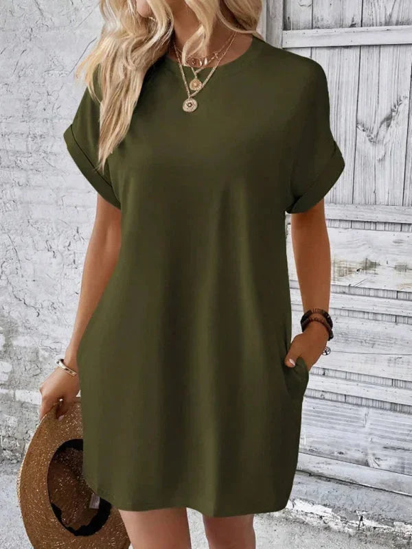 Green - Solid red short-sleeve shift mini dress featuring a crew neckline, rolled cuffs, and side seam pockets.
