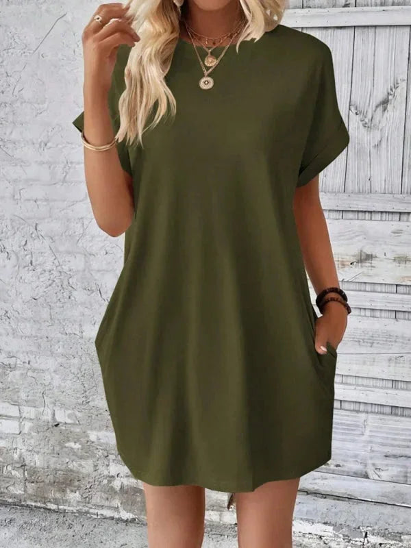 Green - Solid red short-sleeve shift mini dress featuring a crew neckline, rolled cuffs, and side seam pockets.
