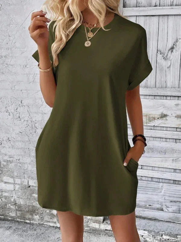 Green - Solid red short-sleeve shift mini dress featuring a crew neckline, rolled cuffs, and side seam pockets.