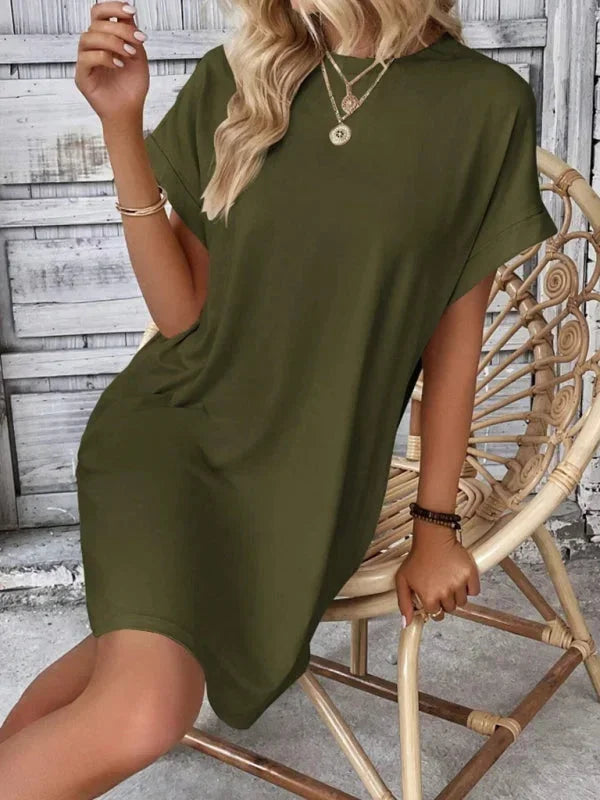 Green - Solid red short-sleeve shift mini dress featuring a crew neckline, rolled cuffs, and side seam pockets.