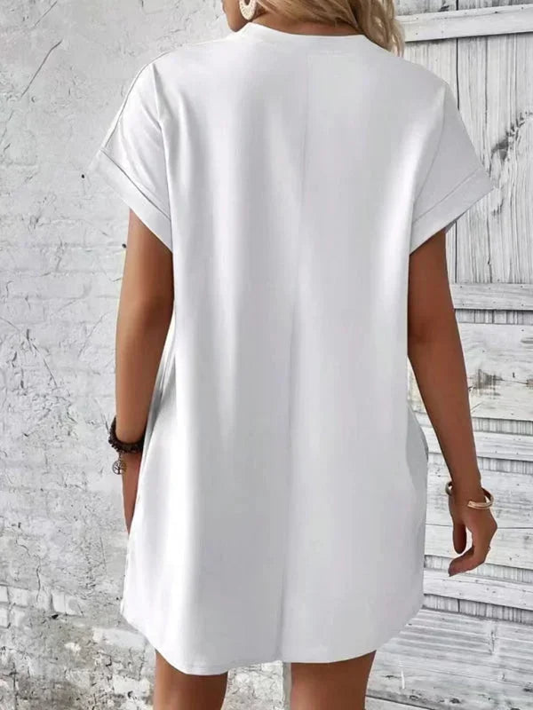 White - Solid red short-sleeve shift mini dress featuring a crew neckline, rolled cuffs, and side seam pockets.