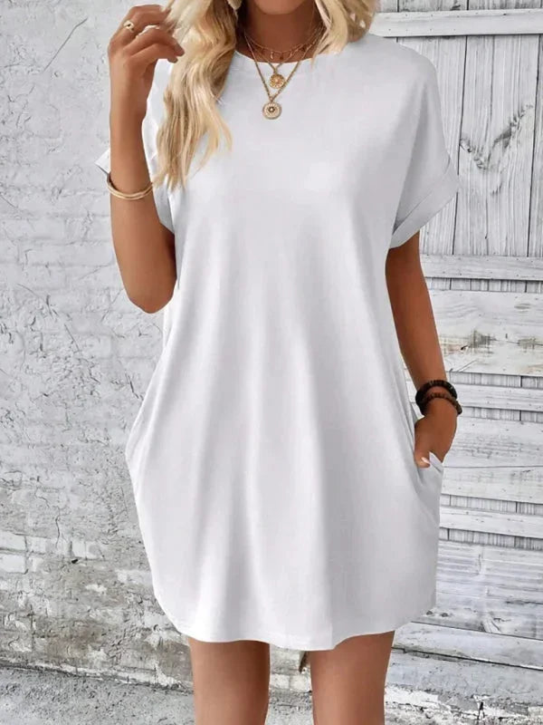 White - Solid red short-sleeve shift mini dress featuring a crew neckline, rolled cuffs, and side seam pockets.