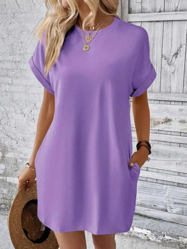 Purple - Solid red short-sleeve shift mini dress featuring a crew neckline, rolled cuffs, and side seam pockets.