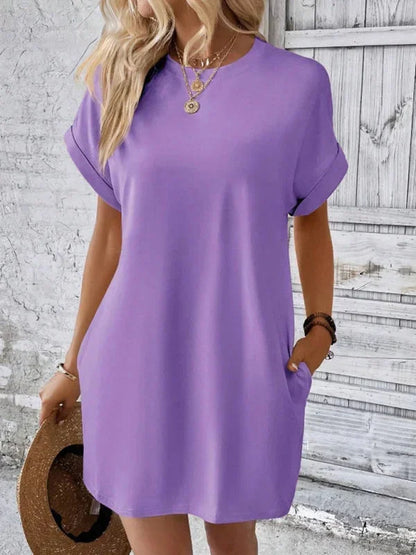 Purple - Solid red short-sleeve shift mini dress featuring a crew neckline, rolled cuffs, and side seam pockets.