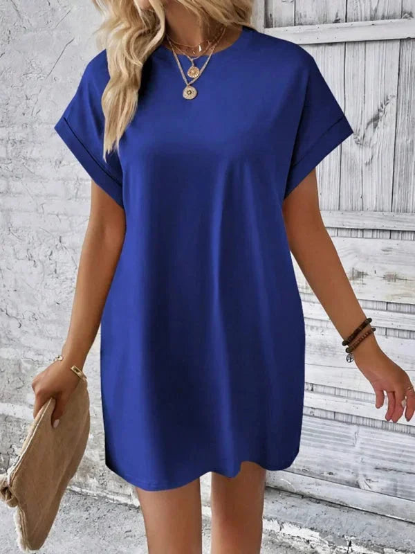 Blue - Solid red short-sleeve shift mini dress featuring a crew neckline, rolled cuffs, and side seam pockets.