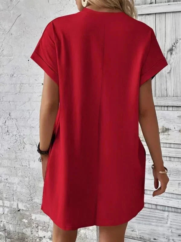 Red - Solid red short-sleeve shift mini dress featuring a crew neckline, rolled cuffs, and side seam pockets.