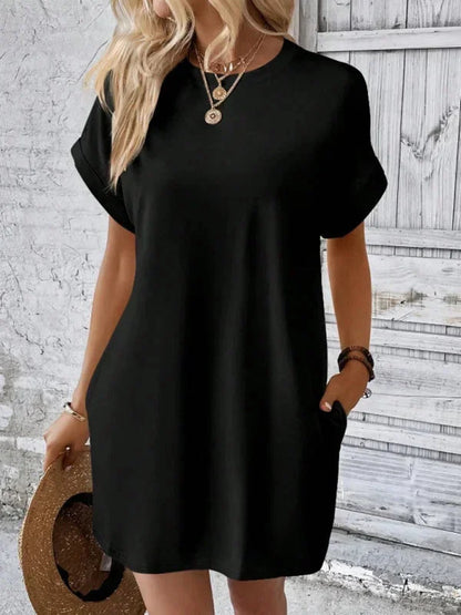 Black - Solid red short-sleeve shift mini dress featuring a crew neckline, rolled cuffs, and side seam pockets.