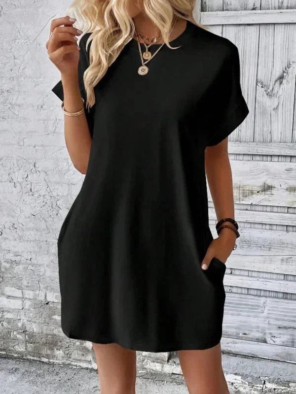 Orange - Solid red short-sleeve shift mini dress featuring a crew neckline, rolled cuffs, and side seam pockets.