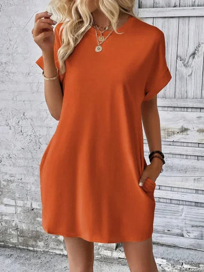 Orange - Solid red short-sleeve shift mini dress featuring a crew neckline, rolled cuffs, and side seam pockets.