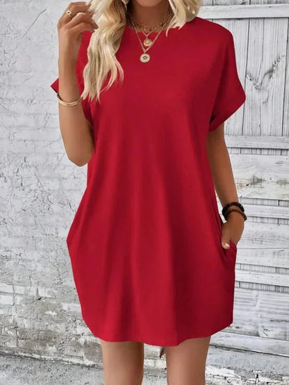 Red - Solid red short-sleeve shift mini dress featuring a crew neckline, rolled cuffs, and side seam pockets.
