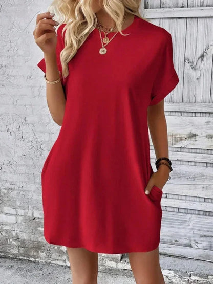 Red - Solid red short-sleeve shift mini dress featuring a crew neckline, rolled cuffs, and side seam pockets.