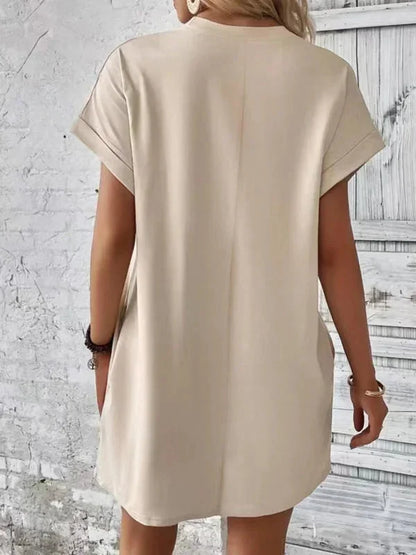 Khaki - Solid red short-sleeve shift mini dress featuring a crew neckline, rolled cuffs, and side seam pockets.