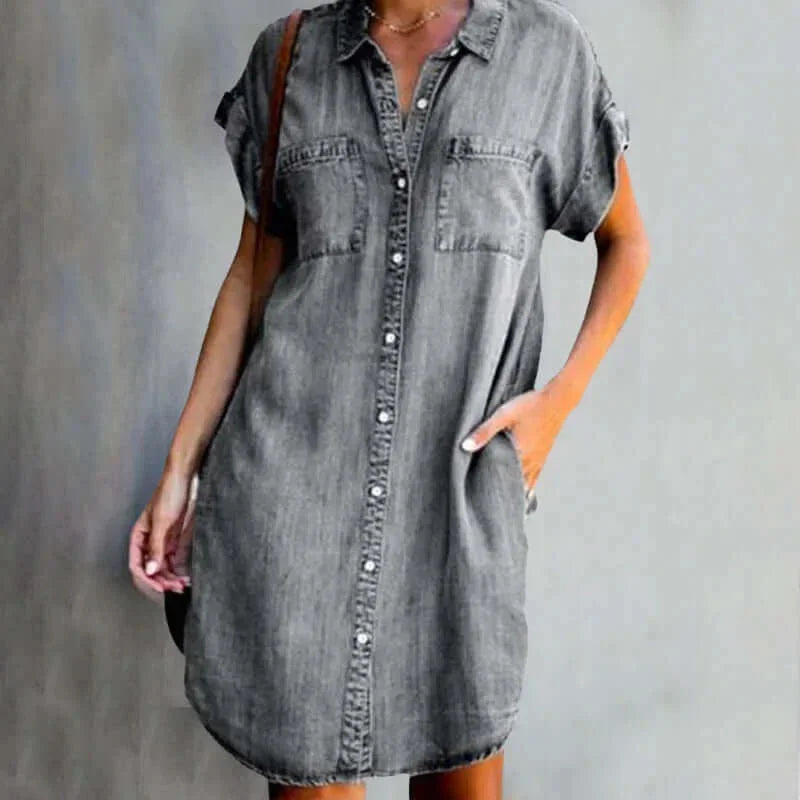Gray - Light wash denim short-sleeve mini shirt dress featuring a collared neckline, button-front closure, dual chest pockets, and a curved hem.