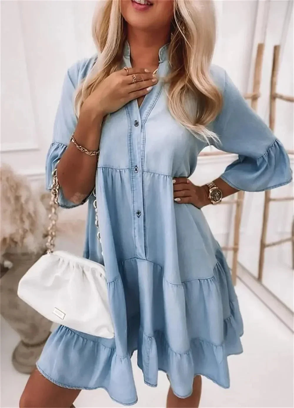 denim - Light blue denim tiered mini dress featuring a collared neckline, half-button placket, and three-quarter bell sleeves.