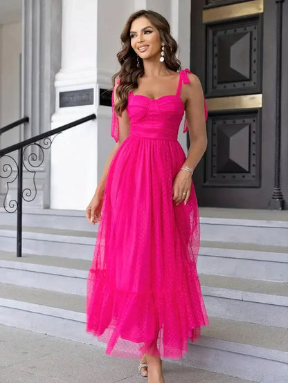 Pink - Bright pink dotted tulle midi dress featuring a ruched bustier bodice, adjustable tie shoulder straps, and a voluminous gathered skirt.