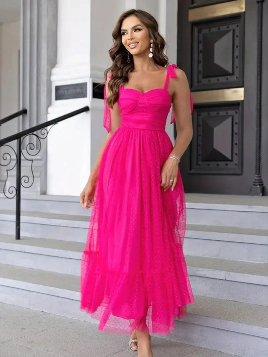 Pink - Bright pink dotted tulle midi dress featuring a ruched bustier bodice, adjustable tie shoulder straps, and a voluminous gathered skirt.