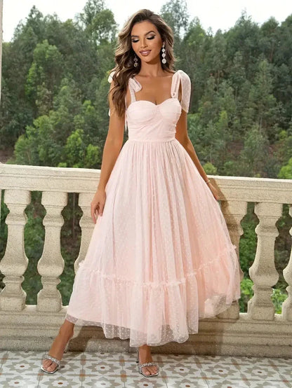 Pale Pink - Bright pink dotted tulle midi dress featuring a ruched bustier bodice, adjustable tie shoulder straps, and a voluminous gathered skirt.