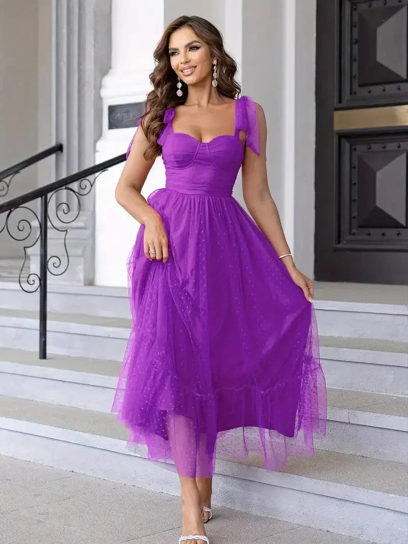 Purple - Bright pink dotted tulle midi dress featuring a ruched bustier bodice, adjustable tie shoulder straps, and a voluminous gathered skirt.