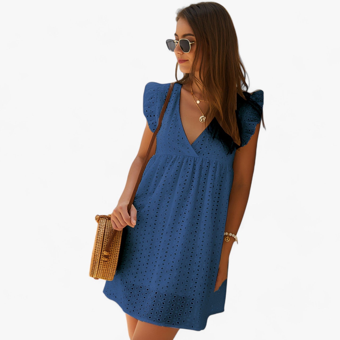 Dark Blue - A woman smiling in a black eyelet mini dress with flutter sleeves, a deep V-neckline, and an empire waist, set against a clean white background.