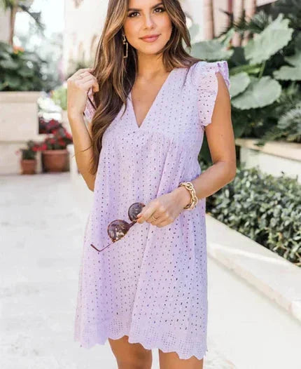 Light Purple - White eyelet mini dress featuring a V-neckline, ruffle flutter sleeves, and a scalloped hem.